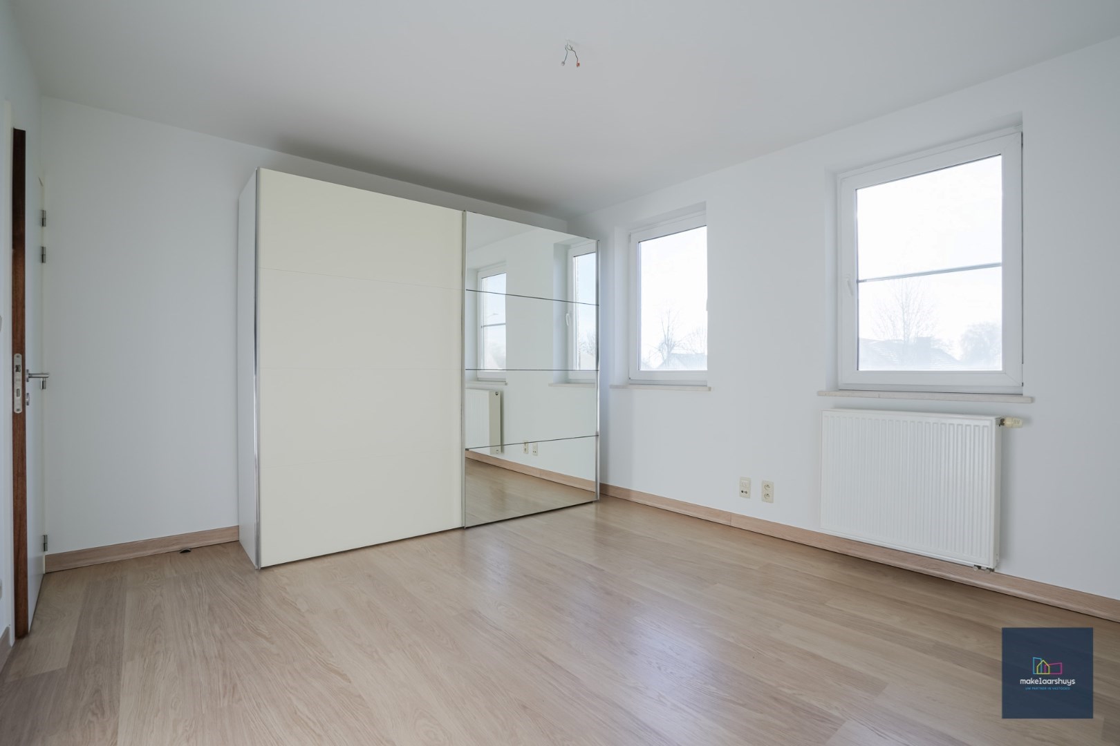 Ruime half-open bebouwing te Heusden met garage en tuin 