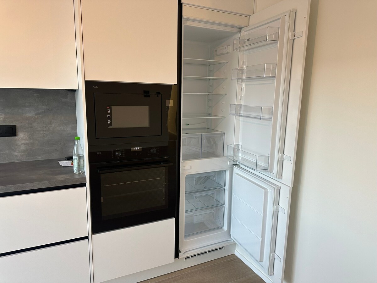 OPTIE!  NIEUW  gelijkvloers appartement met 3 slaapkamers en tuin. 