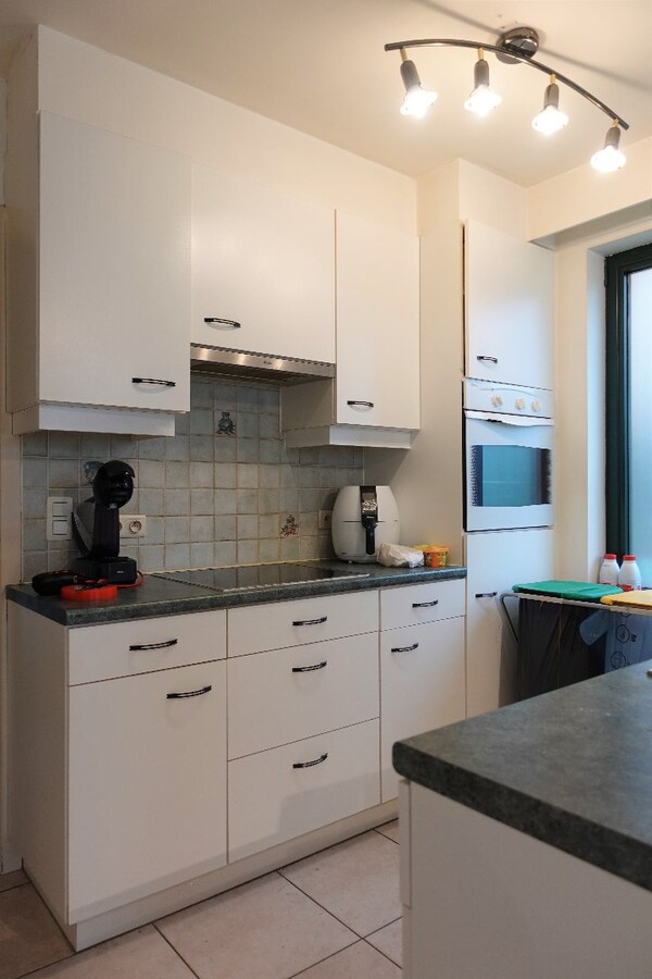 Gezellig gelijkvloersappartement met zonnige tuin en garage 