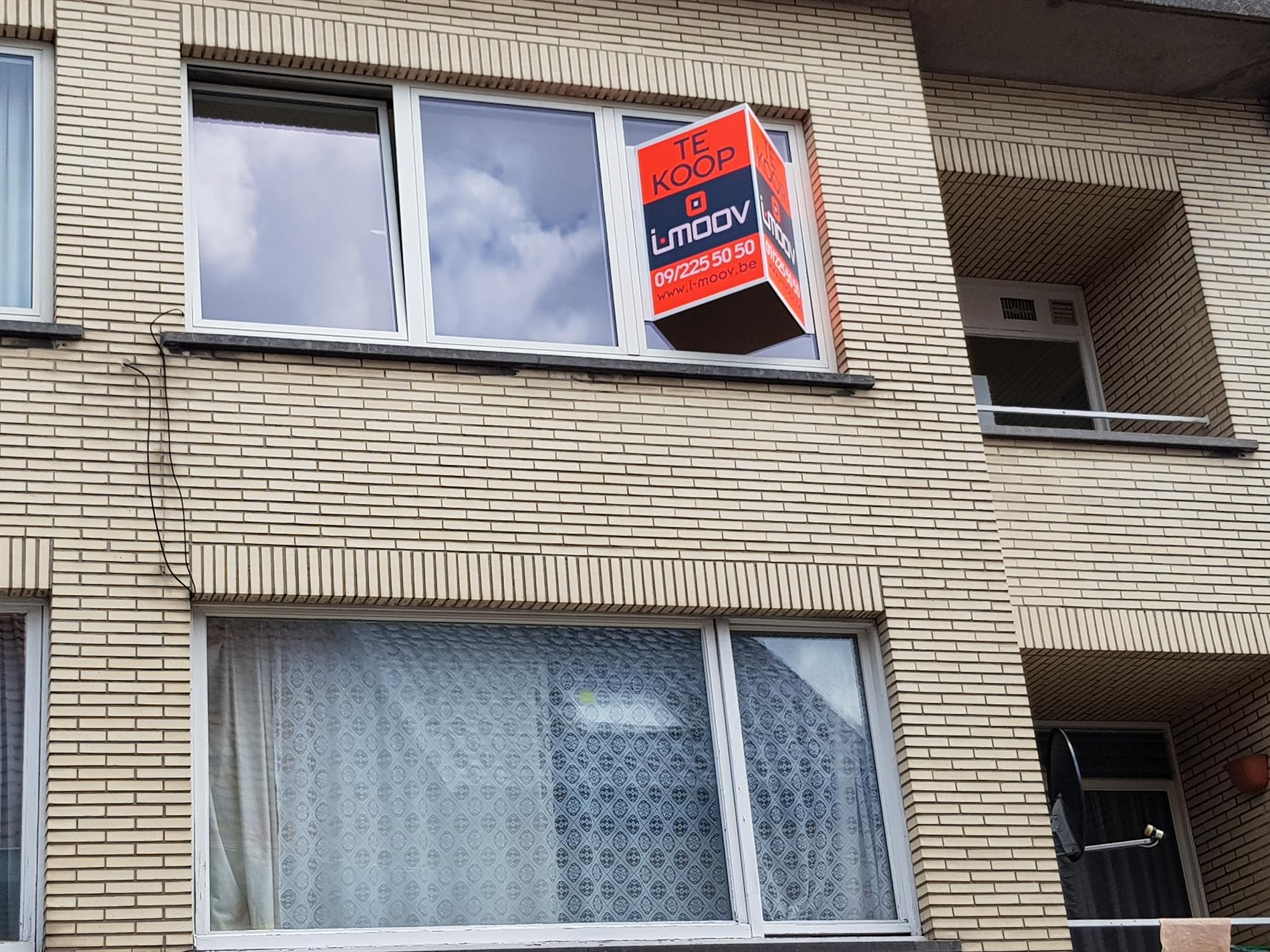 Op te frissen appartement op enkele minuten van markt 