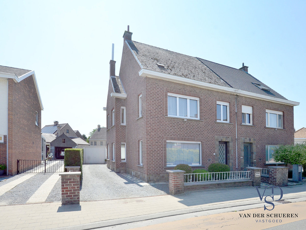 Degelijke woning met tuin en afz. garage. 