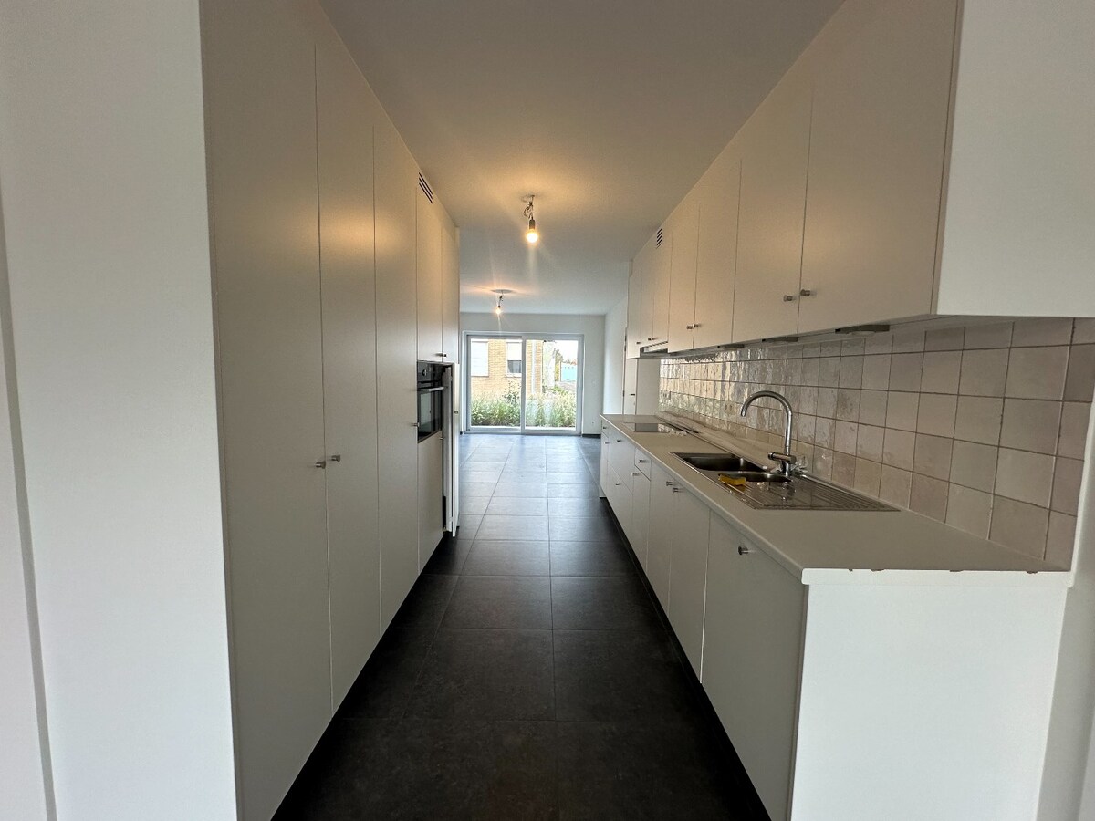 Ruim duplex-appartement met 3 slaapkamers en tuin te Werken 