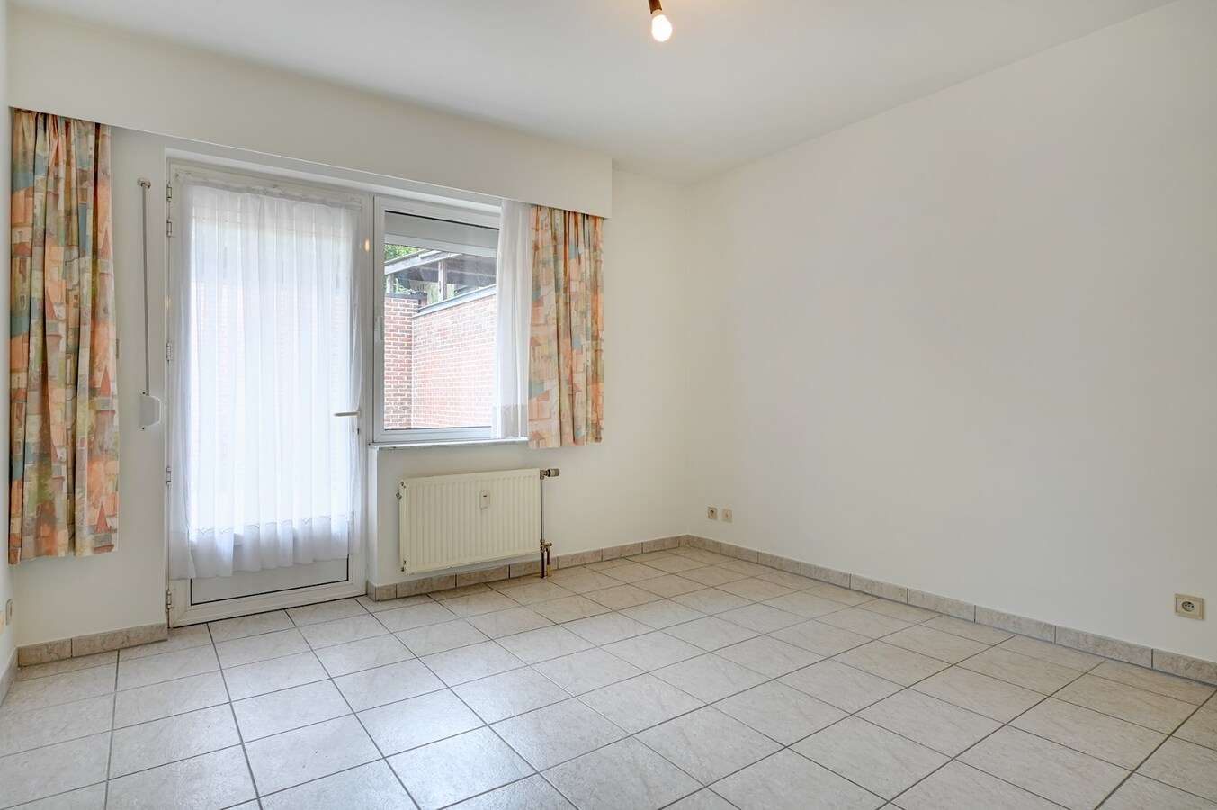 Centraal gelegen appartement met ondergrondse garage en groot terras 