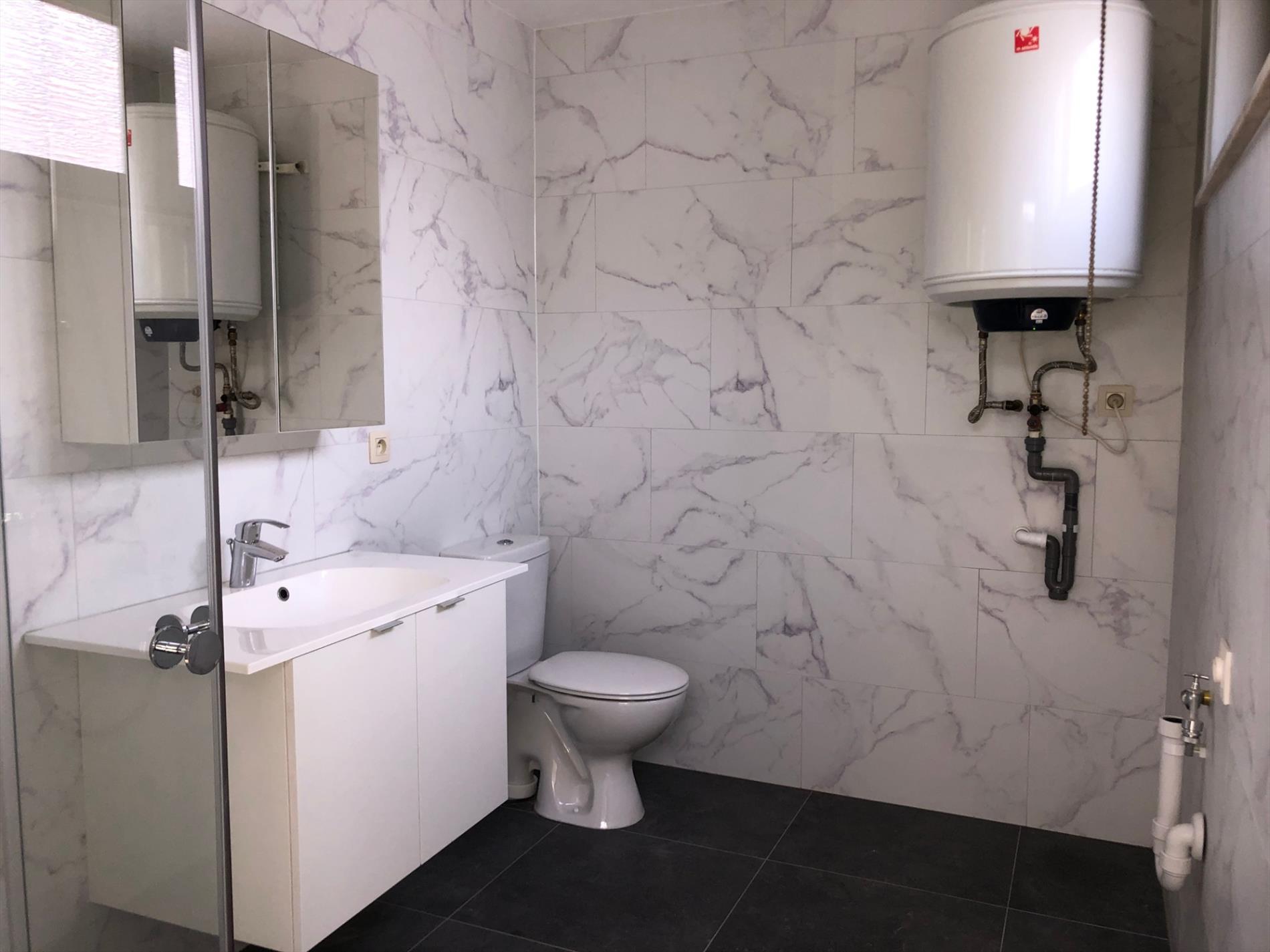 Opgefriste rijwoning met stadskoertje 
