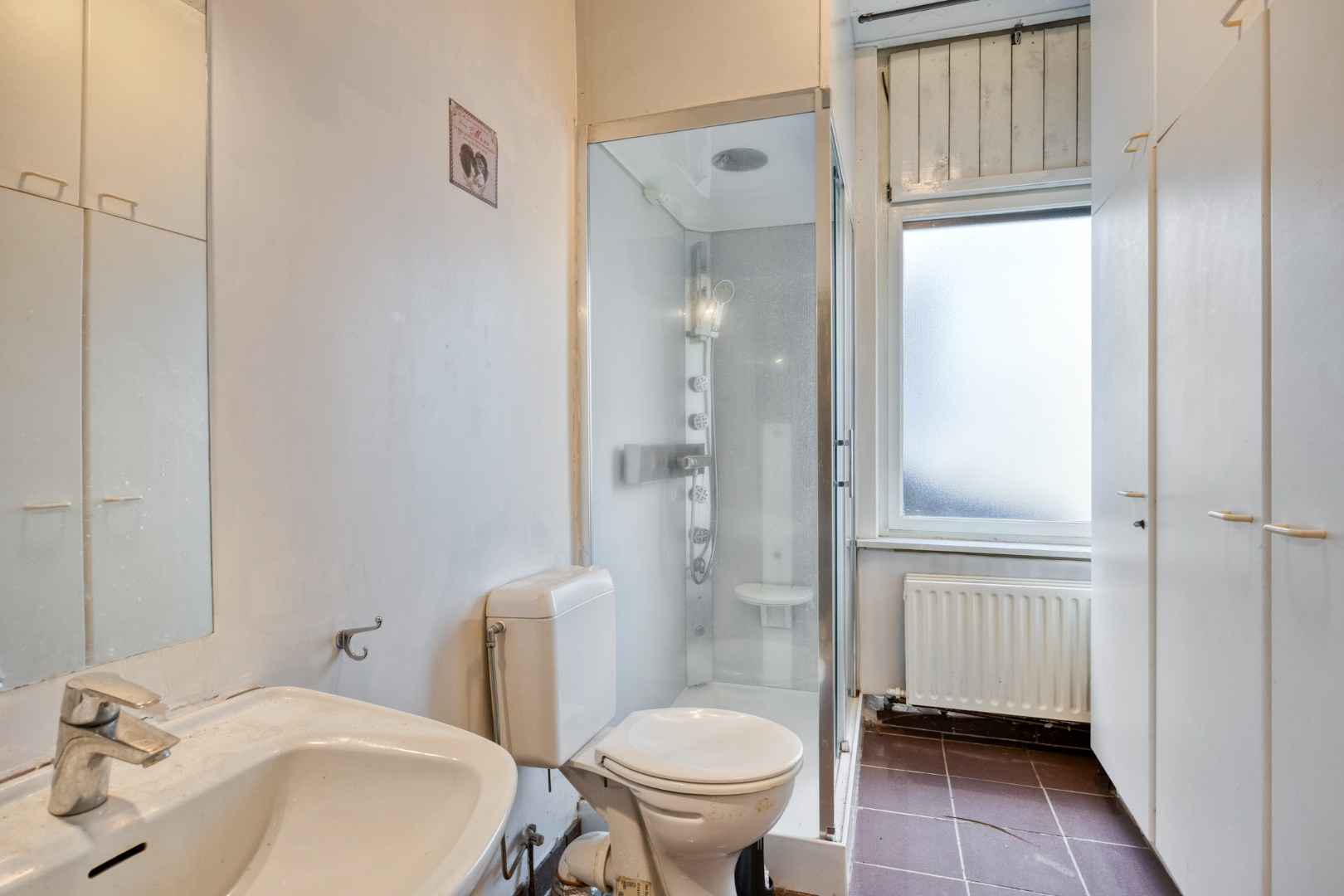 Te renoveren woning met 4 slpk. en gezellige stadstuin op een centrale ligging in Geel 