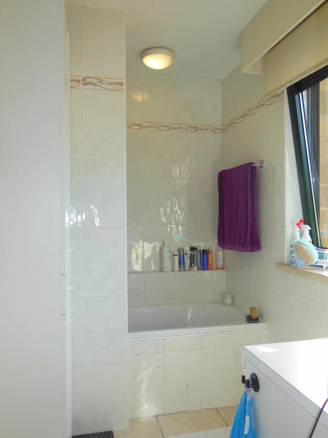 Gezellig gelijkvloersappartement met zonnige tuin en garage 