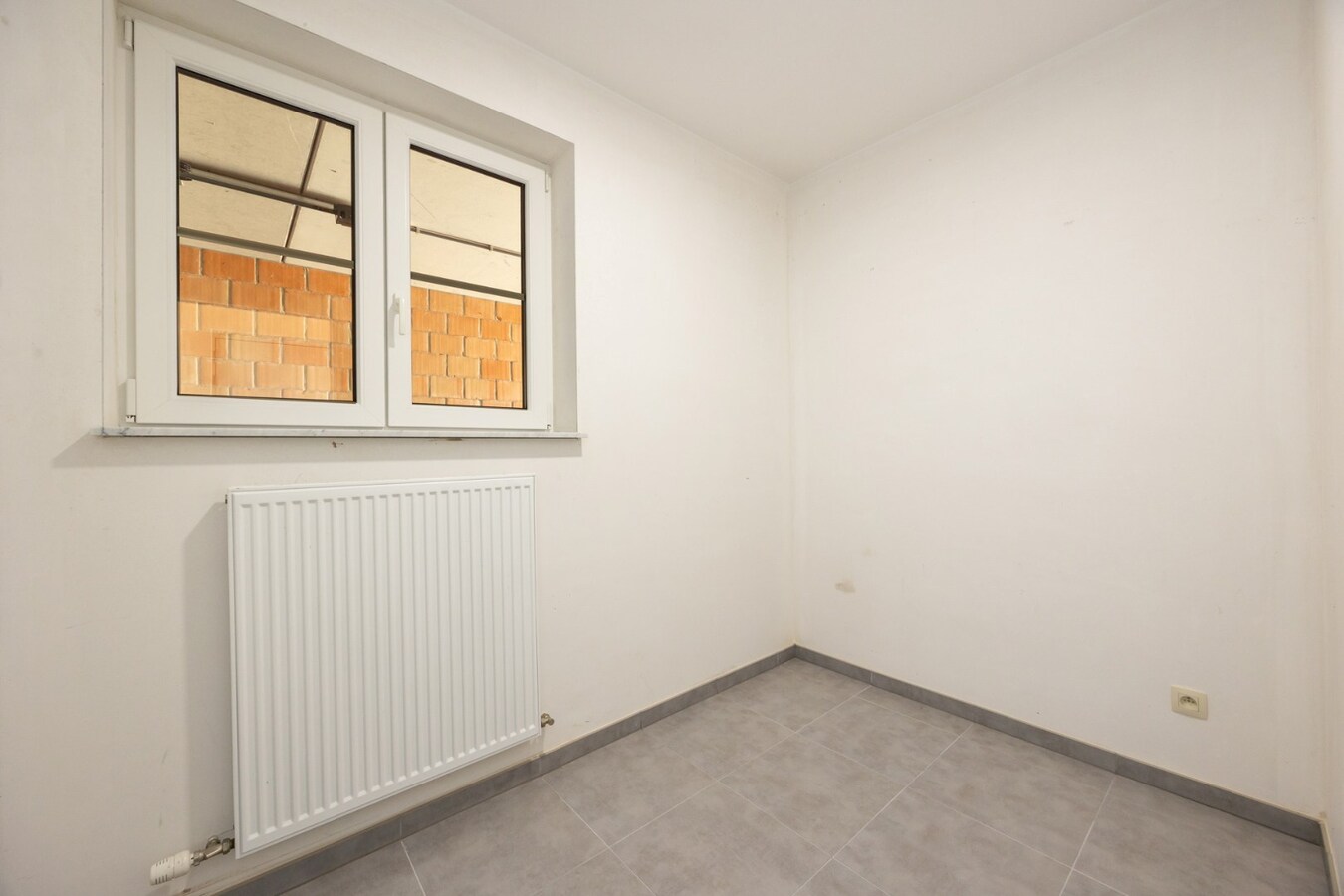 Energiezuinig gelijkvloers appartement met carport in het centrum van Broechem 