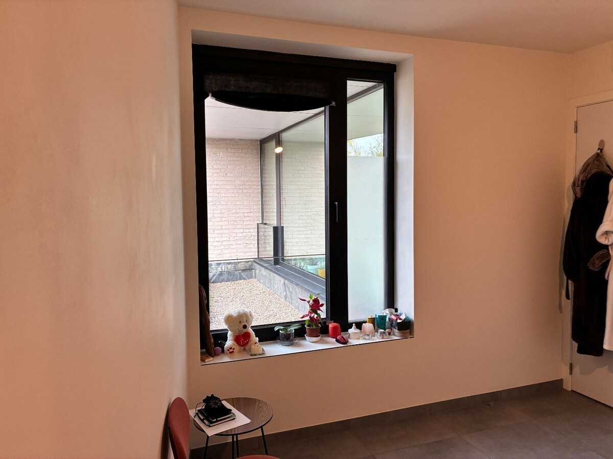 Nieuwbouwwoning op 50m van tramhalte - met terras en tuin ! 