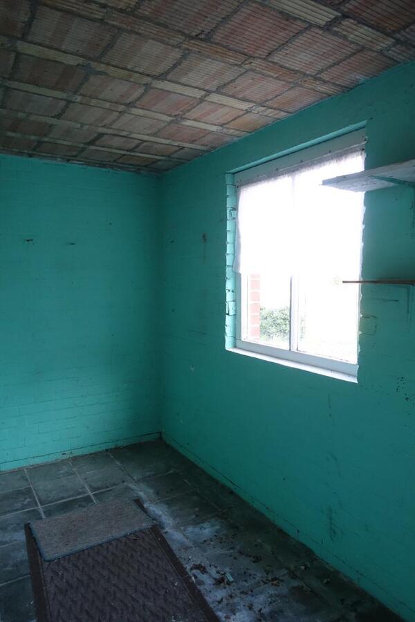 Degelijke rijwoning met garage en grote tuin 