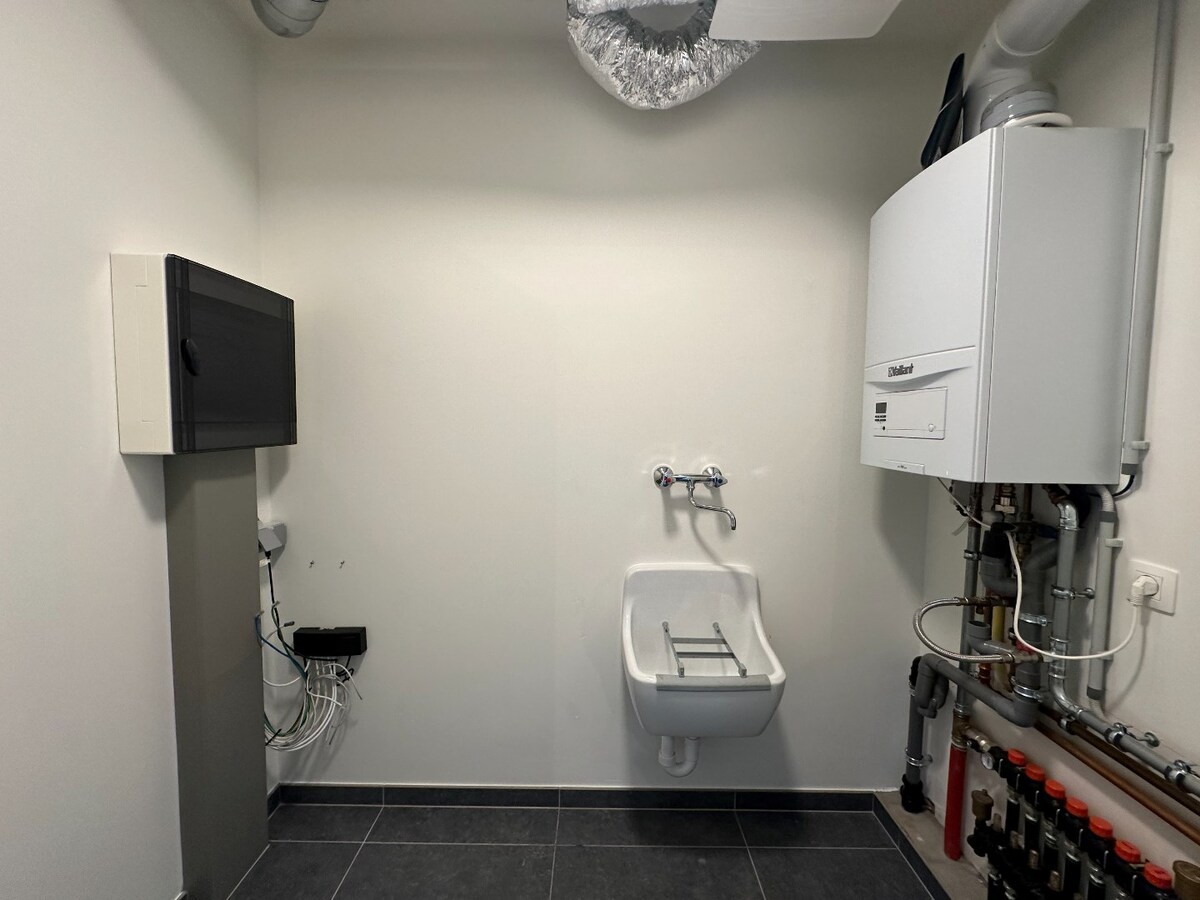 Ruim duplex-appartement met 3 slaapkamers en tuin te Werken 