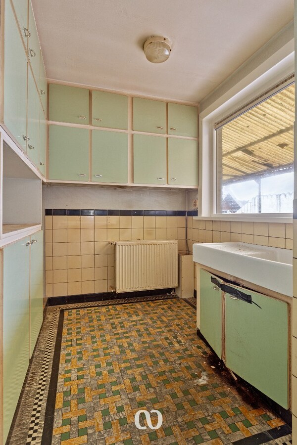 Te renoveren gezinswoning met mooie tuin in Oudenaarde 