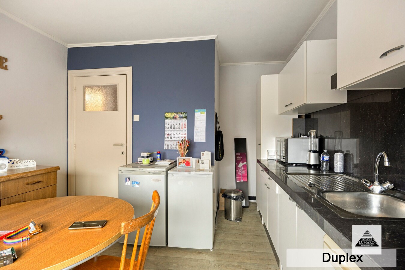 Dilsen-centrum - opbrengstpand: winkel + 2 appartementen 