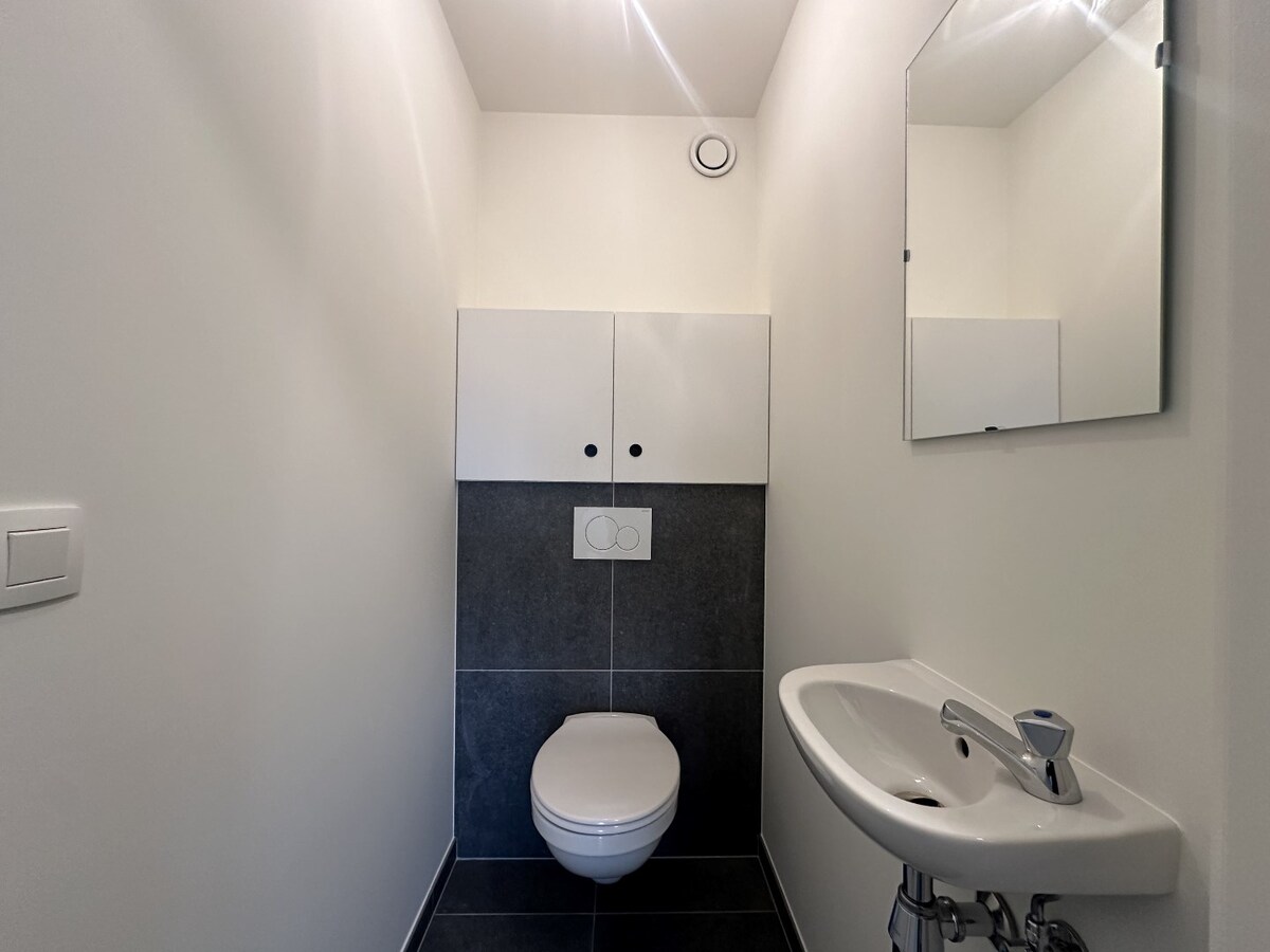 Ruim duplex-appartement met 3 slaapkamers en tuin te Werken 