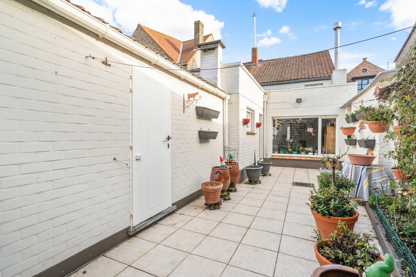 Halfopen bebouwing met terras in Christus - Koning (Stubbekwartier) 