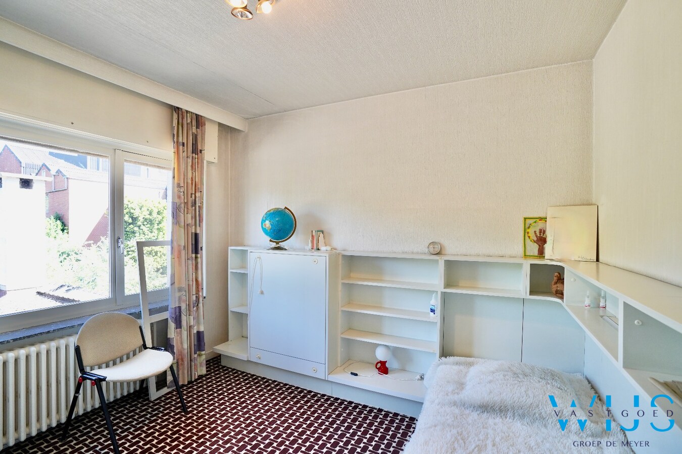 Karaktervolle en instapklare woning met uitzonderlijk perceel van 1.445 m² in hartje Ertvelde 