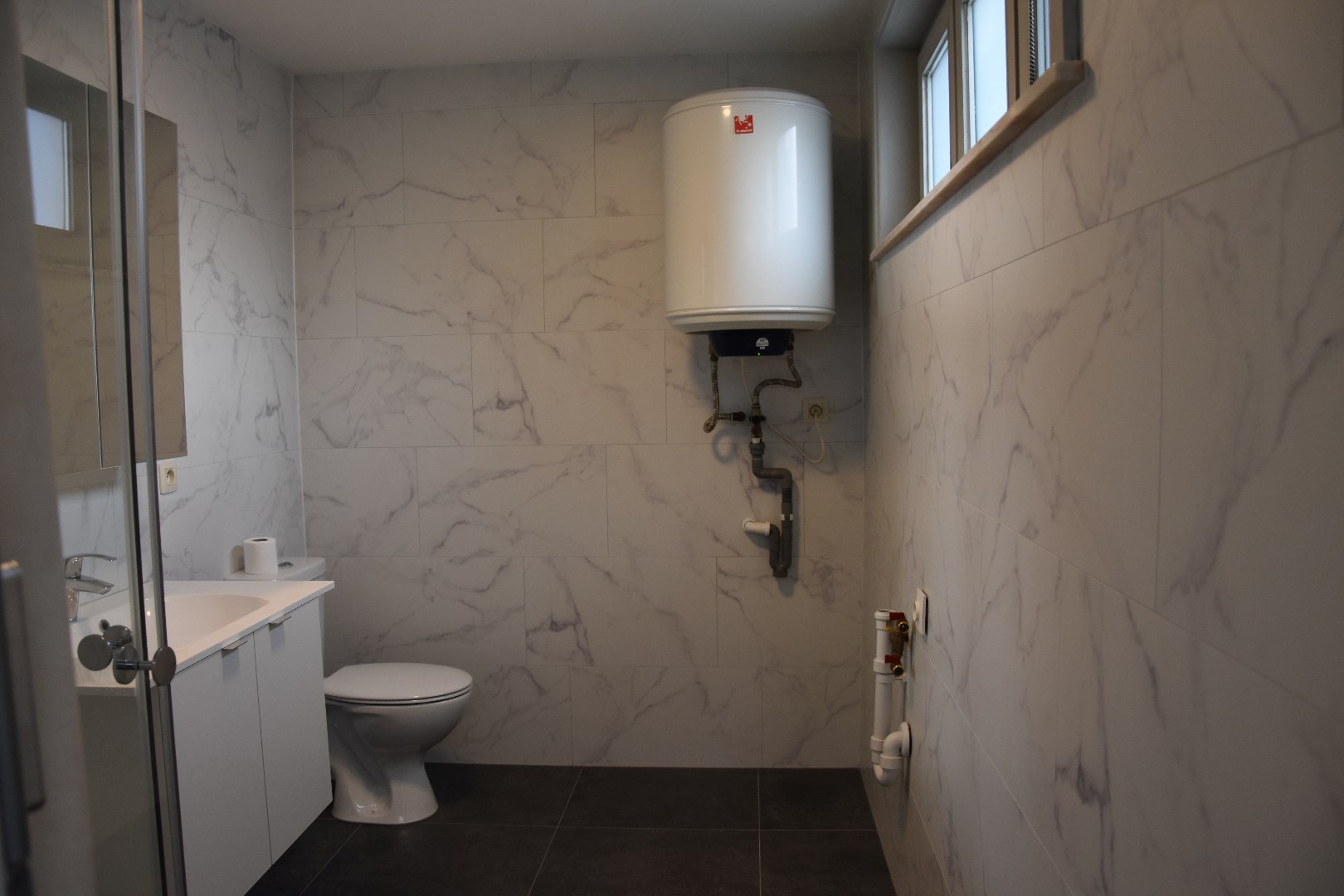 Opgefriste rijwoning met stadskoertje 