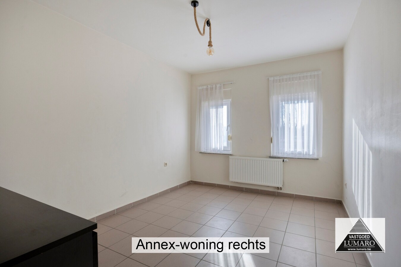 Ideale praktijk- of kangoeroewoning met tuintje en parking 