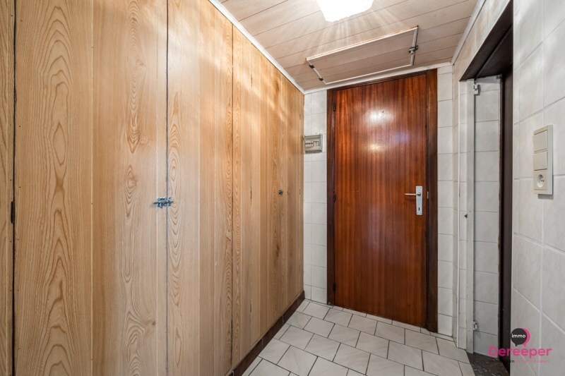 Te renoveren rijwoning op centrale ligging met leuke zuidgerichte tuin 