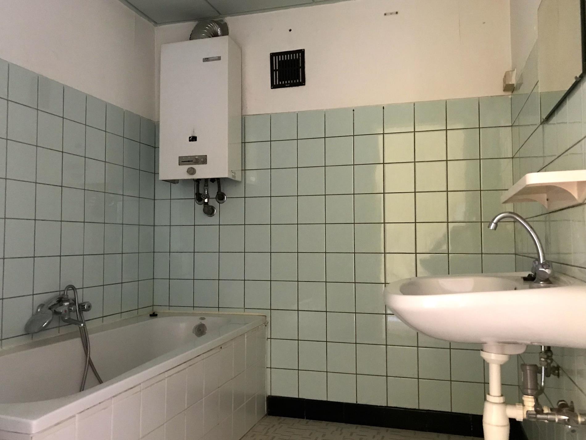 Op te frissen appartement op enkele minuten van markt 