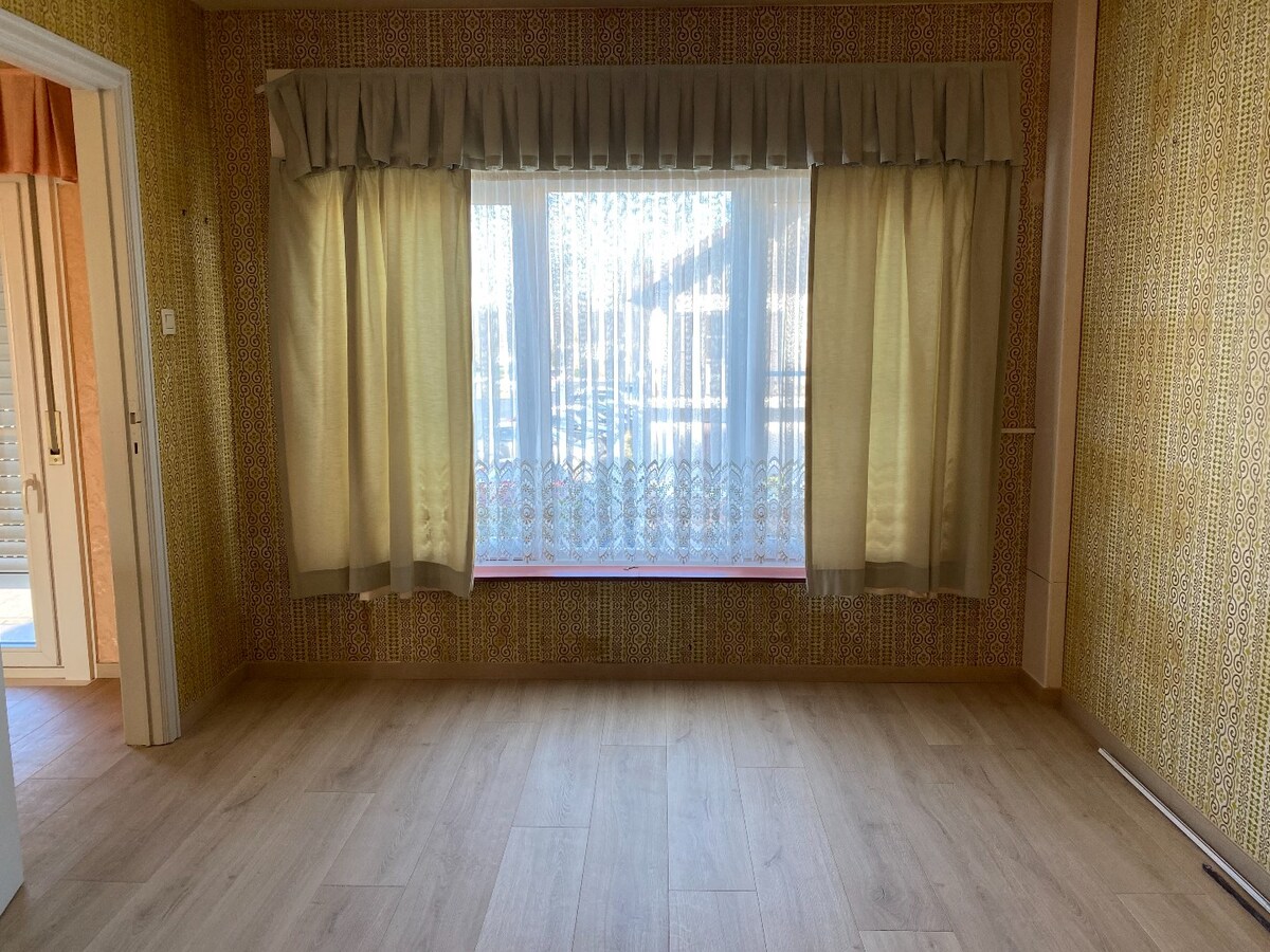 Ruime halfopen woning met garage, 3 slaapkamers en tuin 