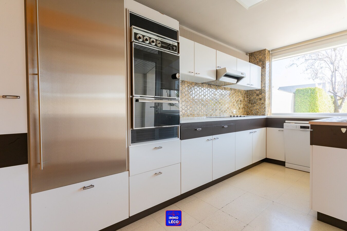 Maison "Bel-Etage" avec double garage, jardin, en plein centre-ville ! 
