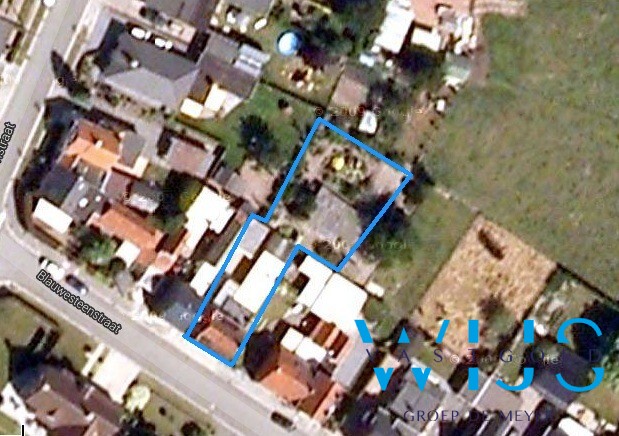 Centraal gelegen woning met mooie grond te Ertvelde! 