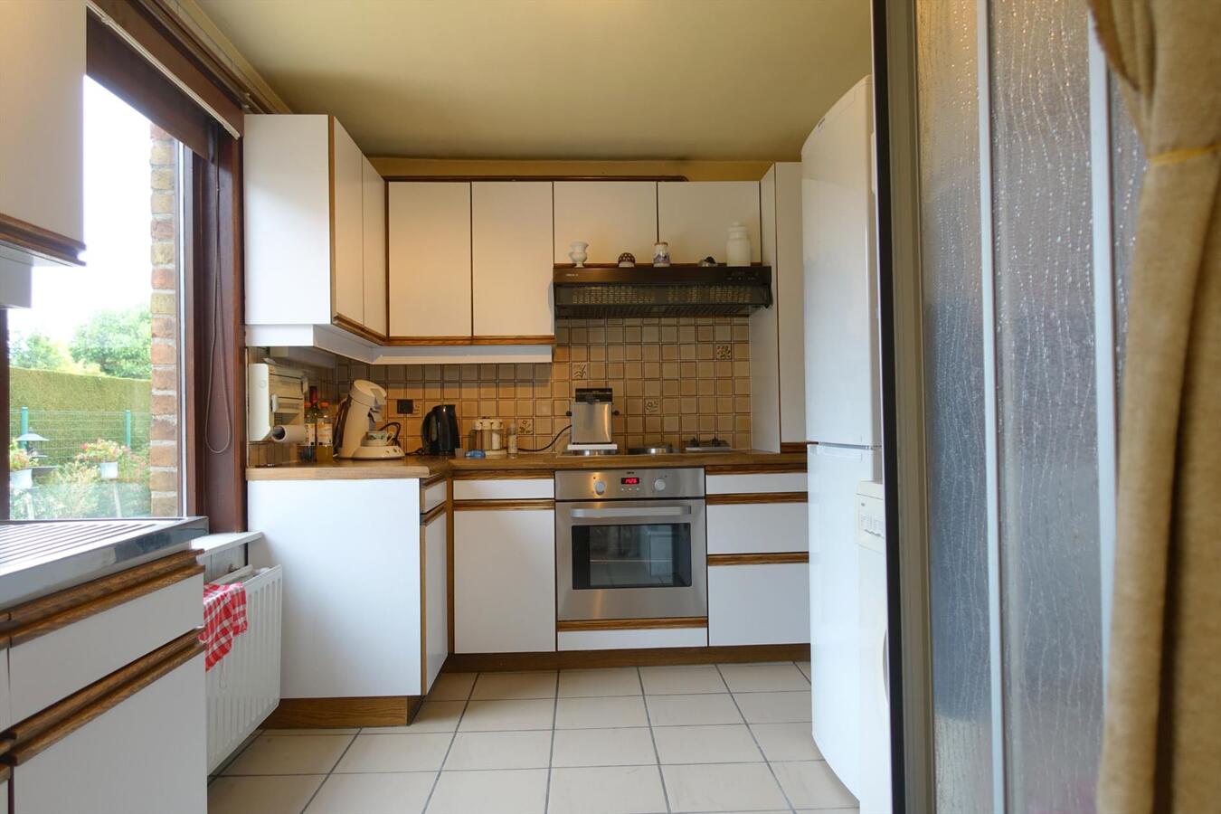 Zonnige charmante half-open woning 