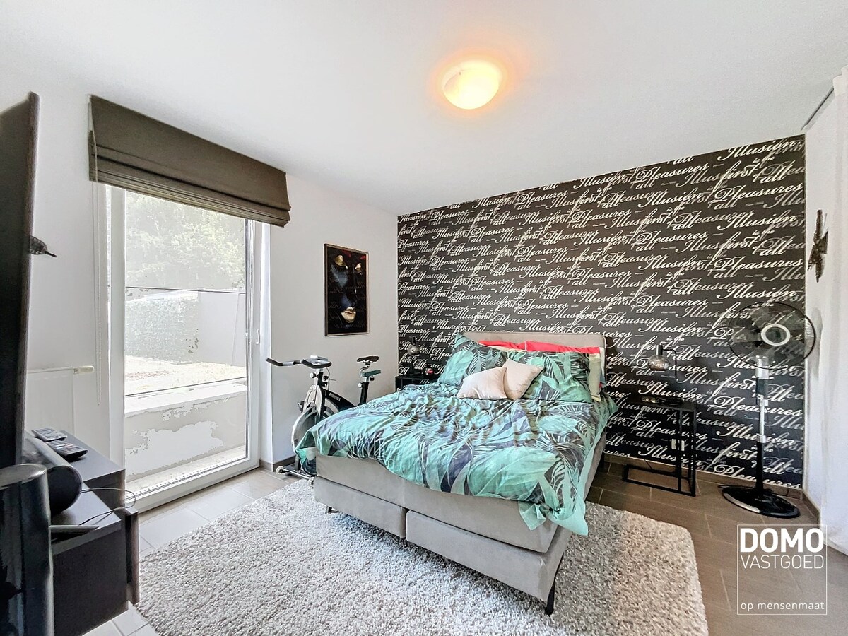 Gelijkvloers appartement met tuin en ondergrondse garage te Kermt - energielabel B -121m² bewoonbare oppervlakte 