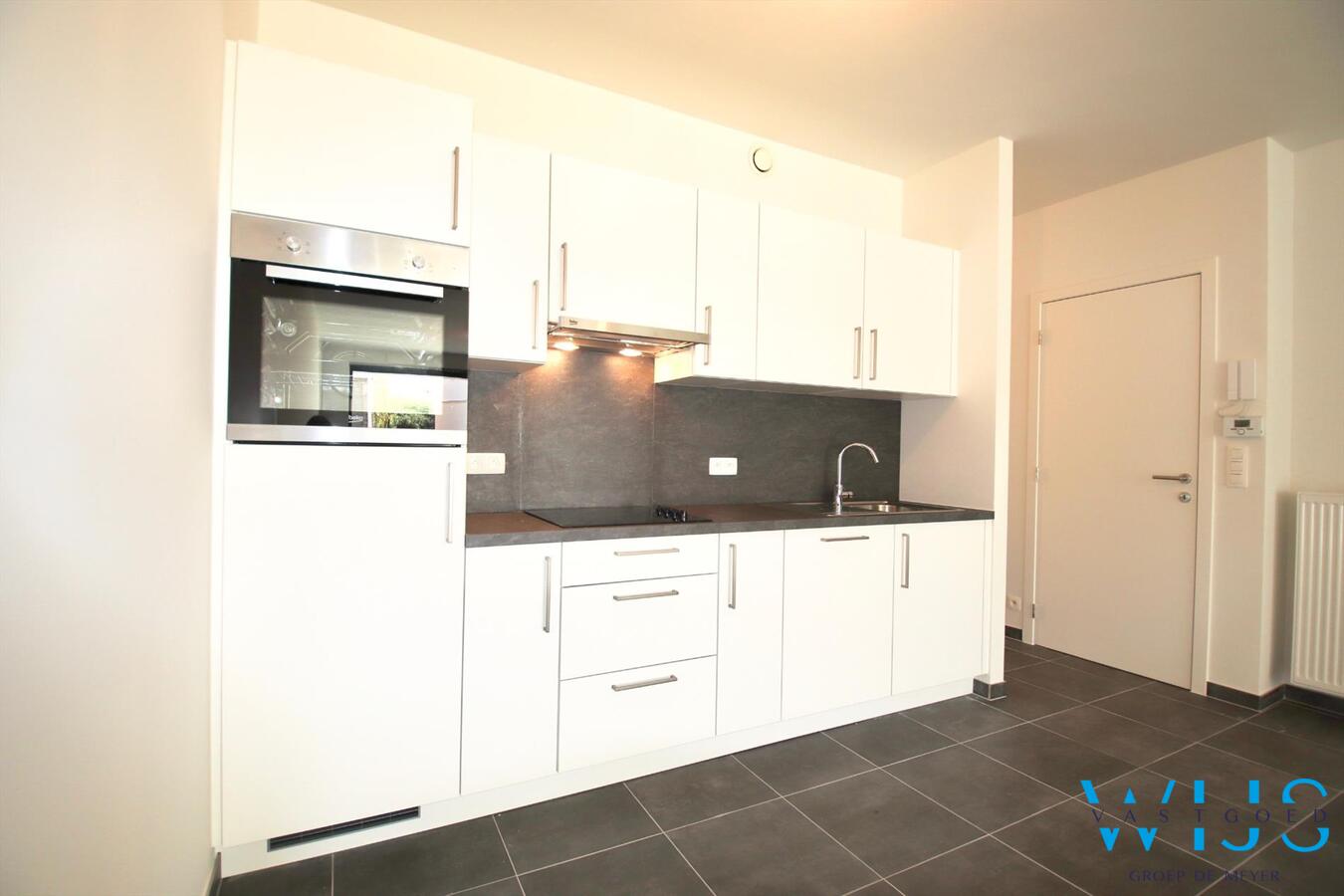 Gelijkvloers appartement met TUIN &amp; GARAGE te Zelzate! 