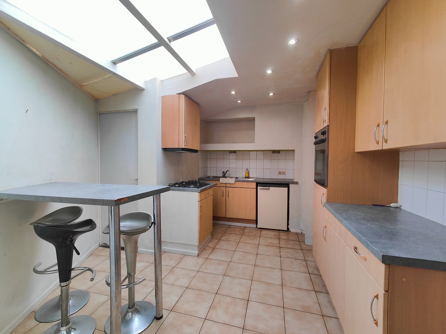 Op te frissen woning met tuin en berging op centrale ligging 