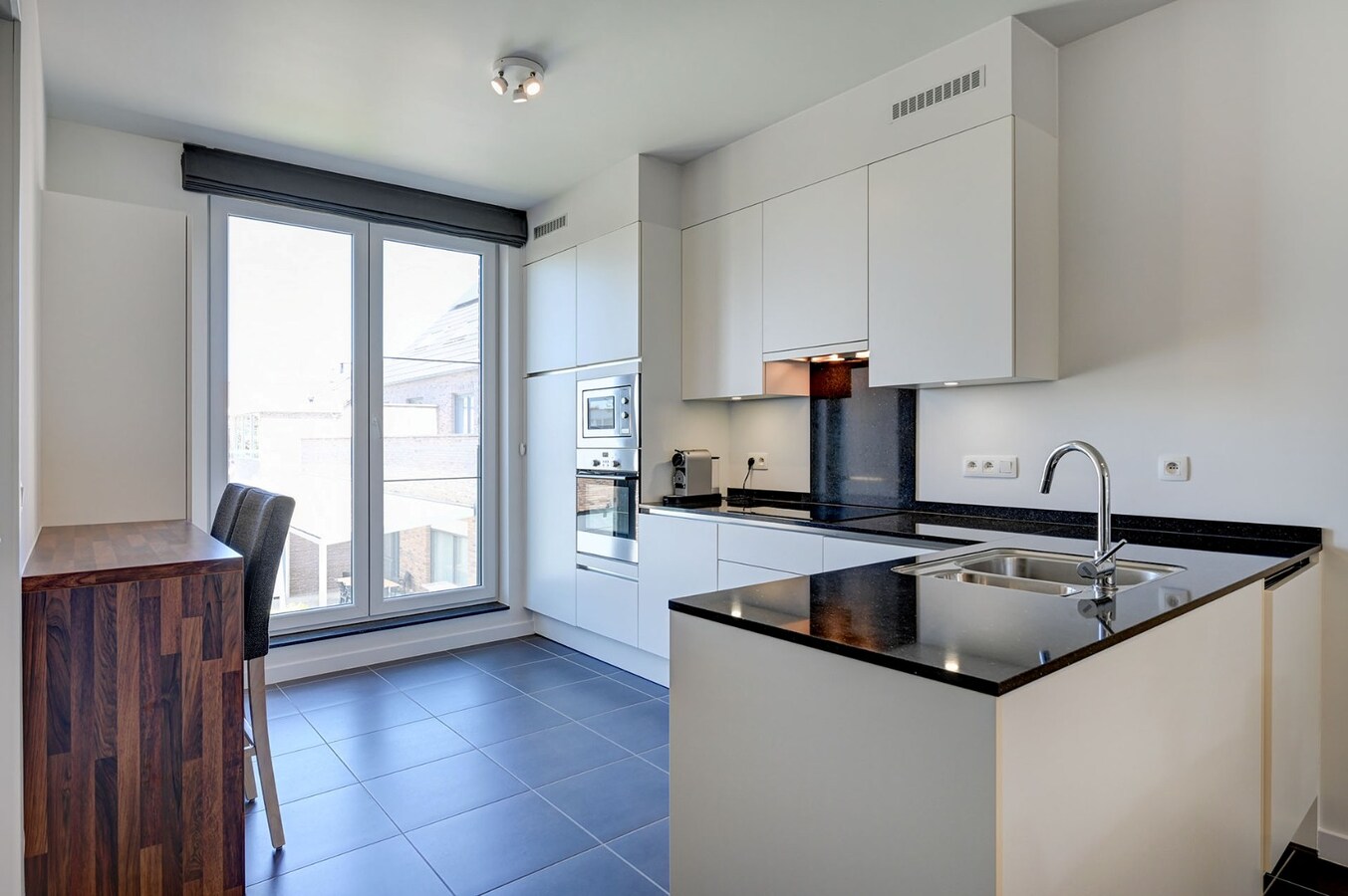 Centraal gelegen appartement met mooi terras en ondergrondse staanplaats 