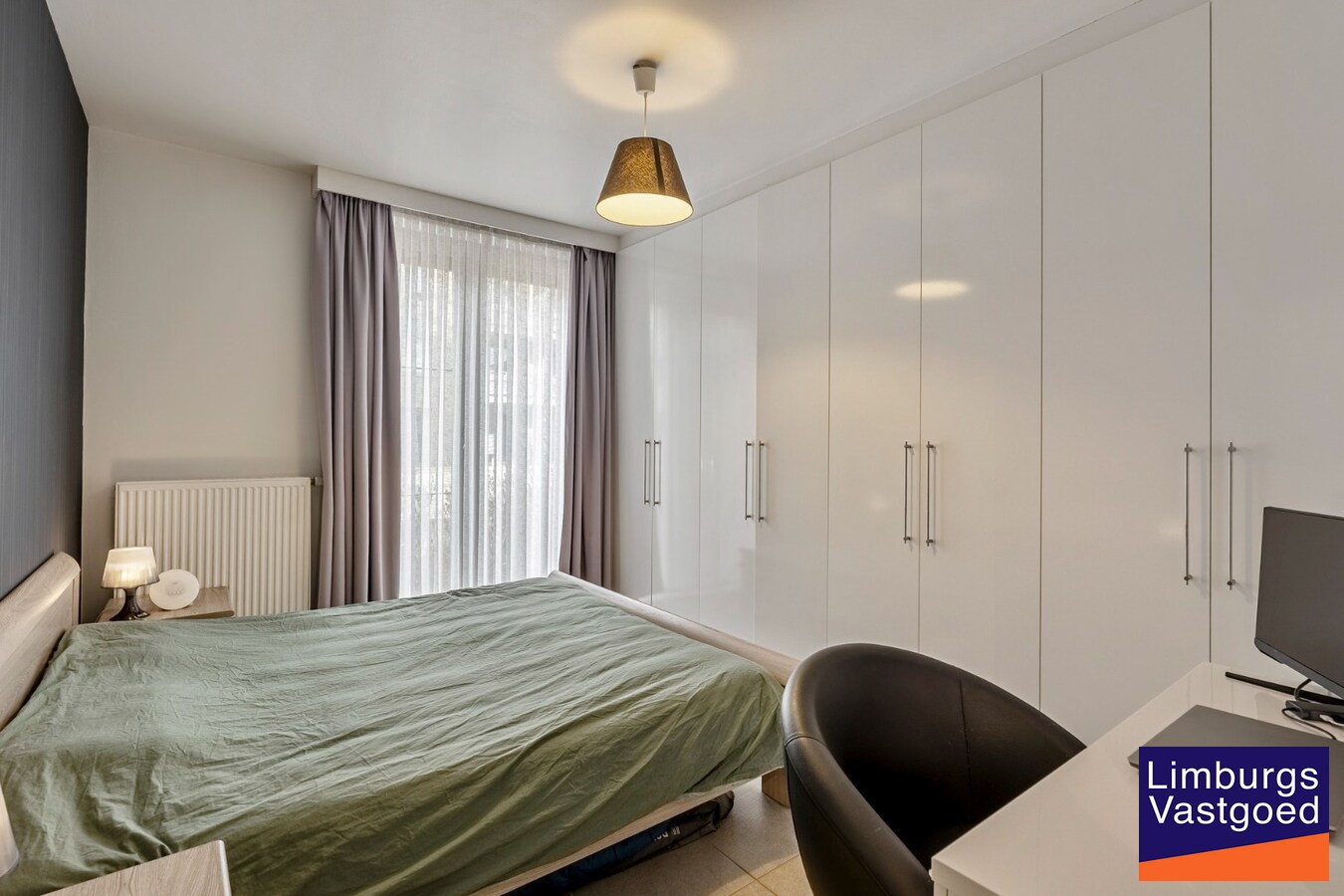 Gelijkvloers appartement (105m²), 2 slpk, tuin/terras, autostaanplaats + kelderberging 