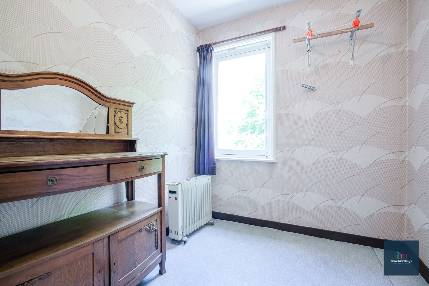 Centraal gelegen te renoveren woning in rij met tuin te Mariakerke 