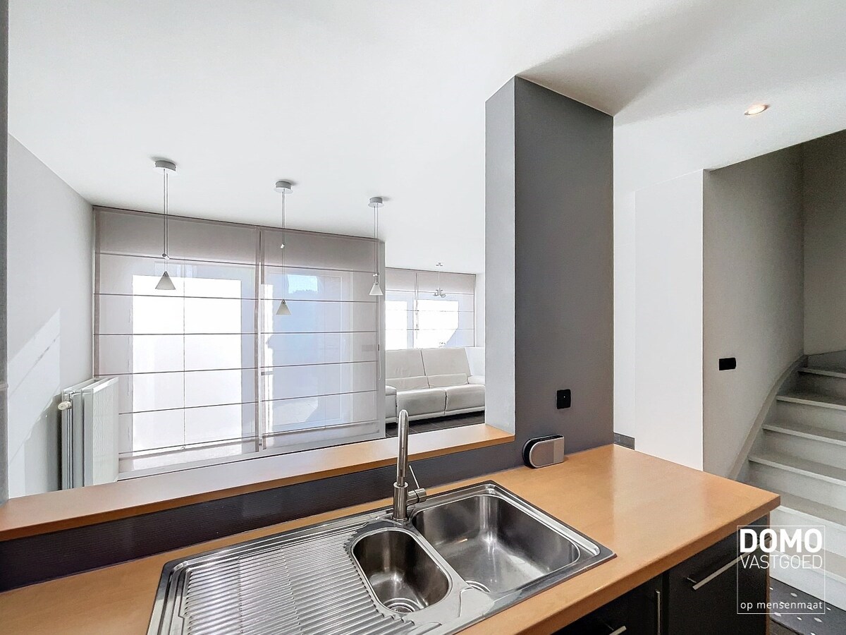 Duplex appartement met een gezellig tuintje, ondergrondse autostandplaats en 2 slaapkamers te Spalbeek - energielabel B, 109m² bewoonbare oppervlakte 