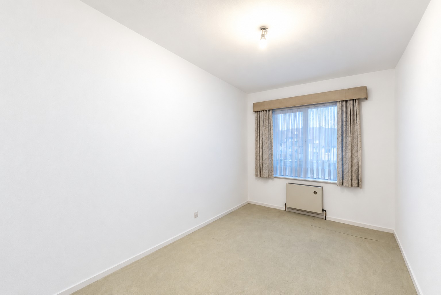 Lichtrijk appartement met 2 slaapkamers en zuidoostgericht terras nabij Gent-Dampoort 