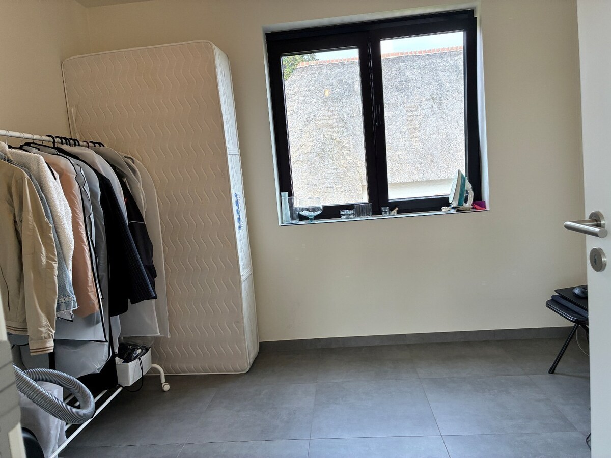 Nieuwbouwwoning op 50m van tramhalte - met terras en tuin ! 