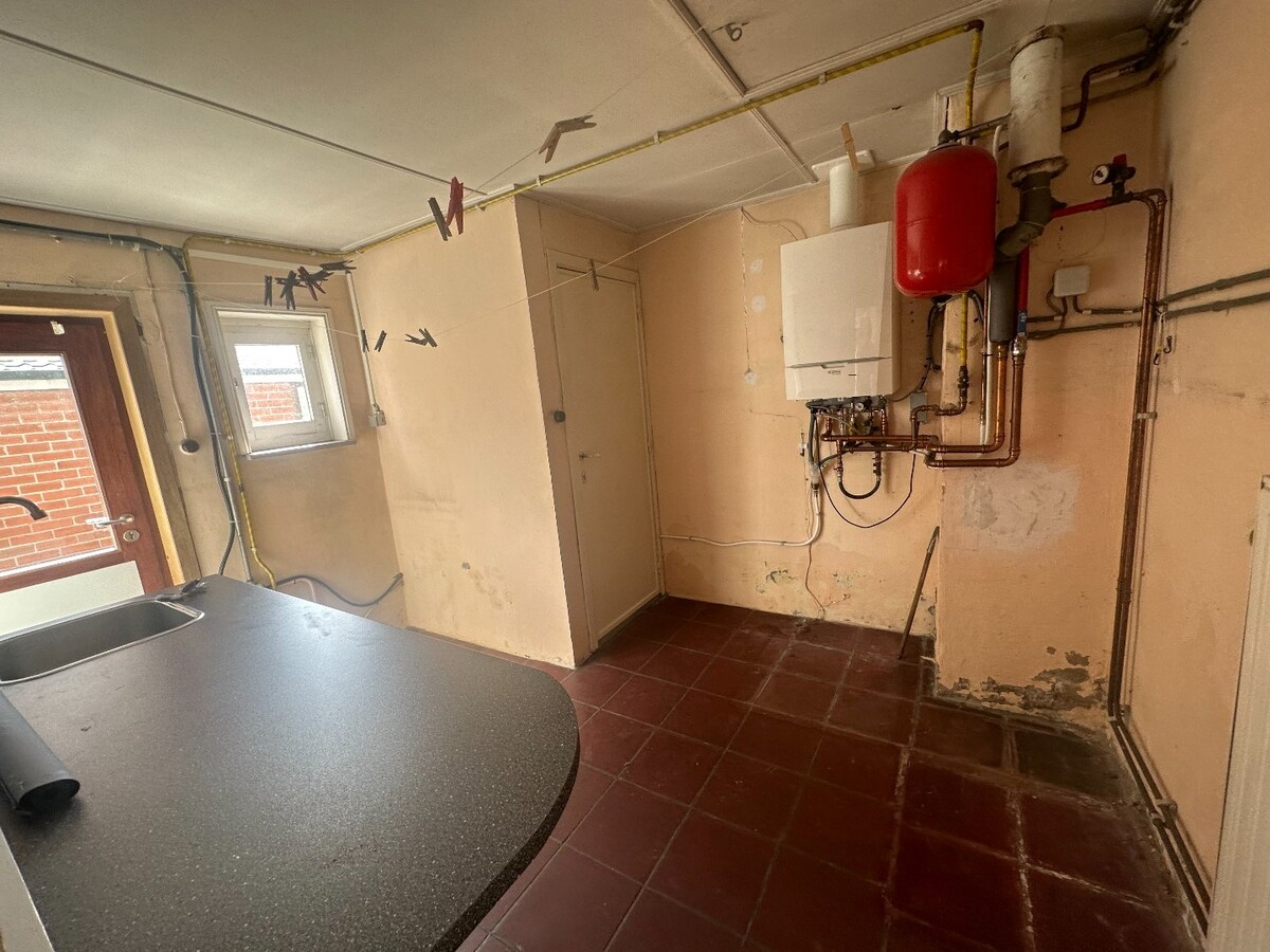 Halfopen woning met 3 slaapkamers op de Markt in Houthulst 