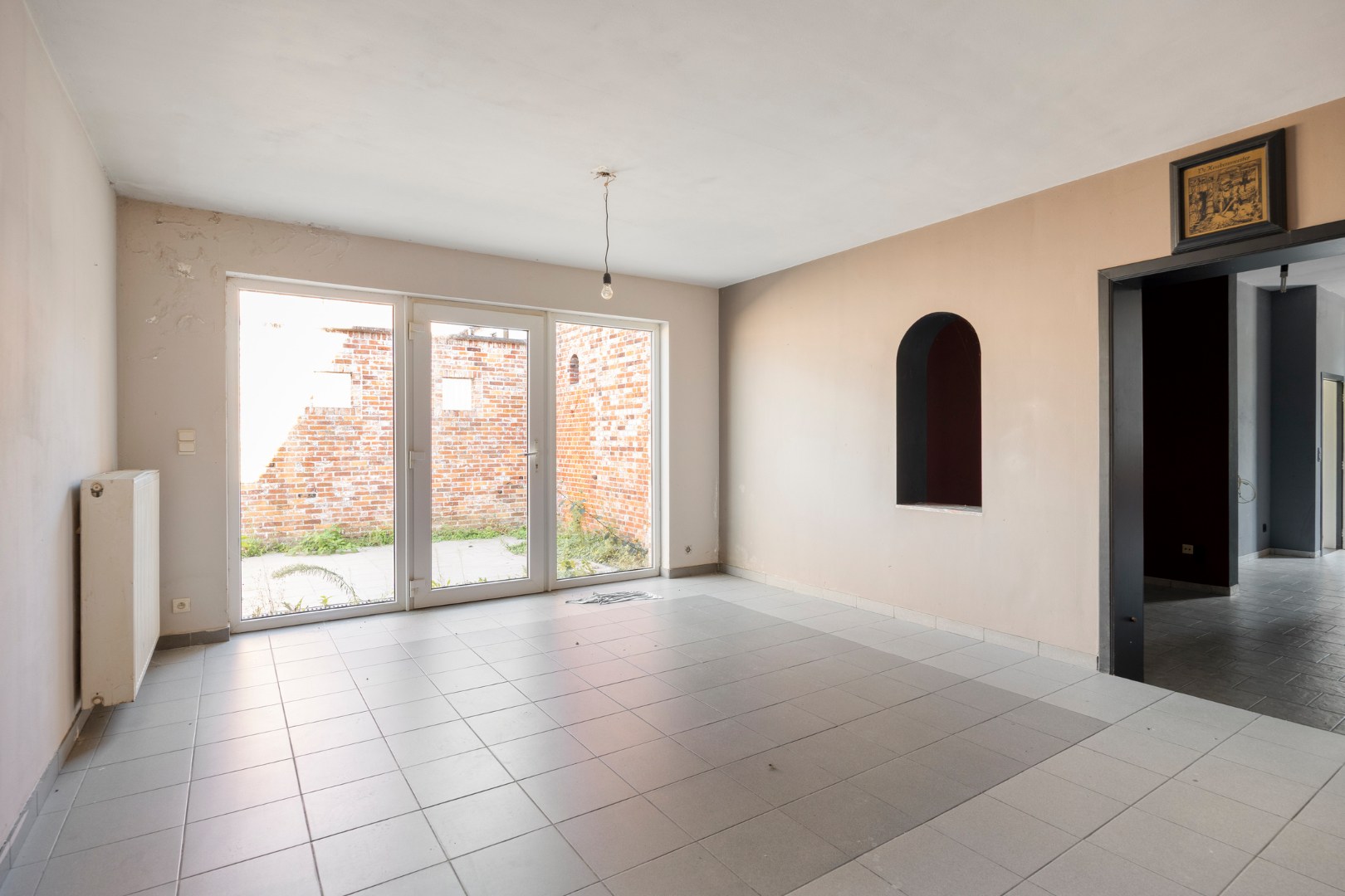 Op te frissen opbrengsteigendom met 3 appartementen en garage in Leopoldsburg 
