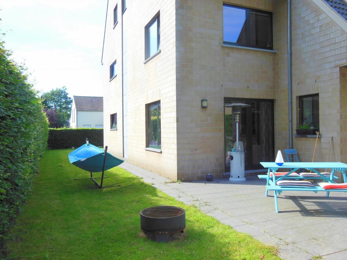 Gezellig gelijkvloersappartement met zonnige tuin en garage 