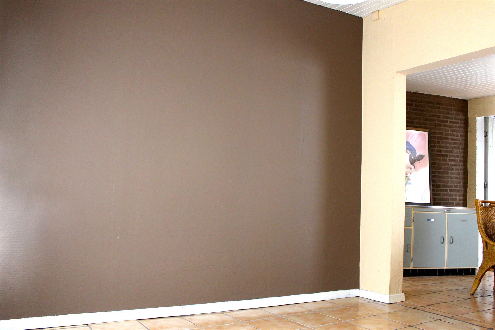 Te renoveren rijwoning met zonnige tuin 