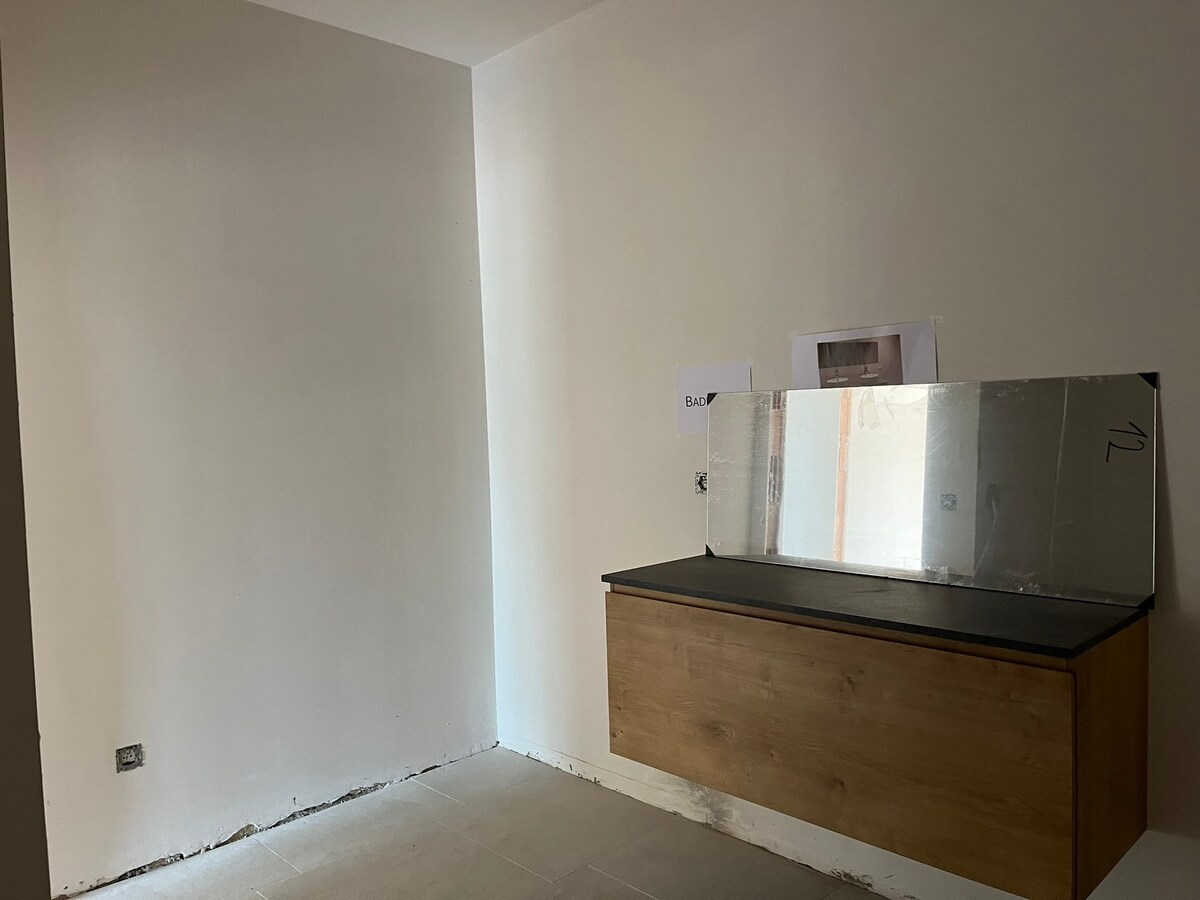 Nieuw gelijkvloers appartement met terras en tuintje 