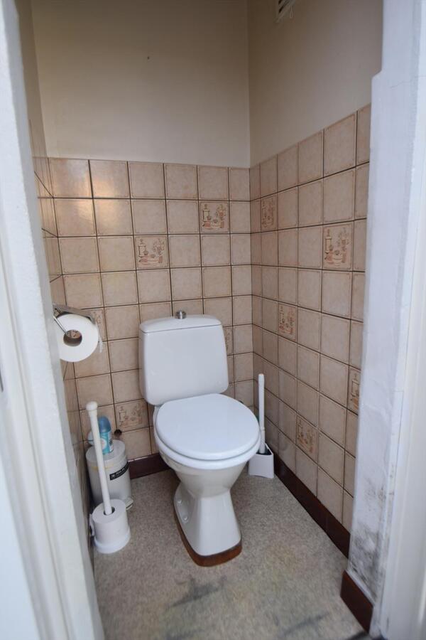 Ruime halfopen 3-slaapkamer-woning met garage en tuin 