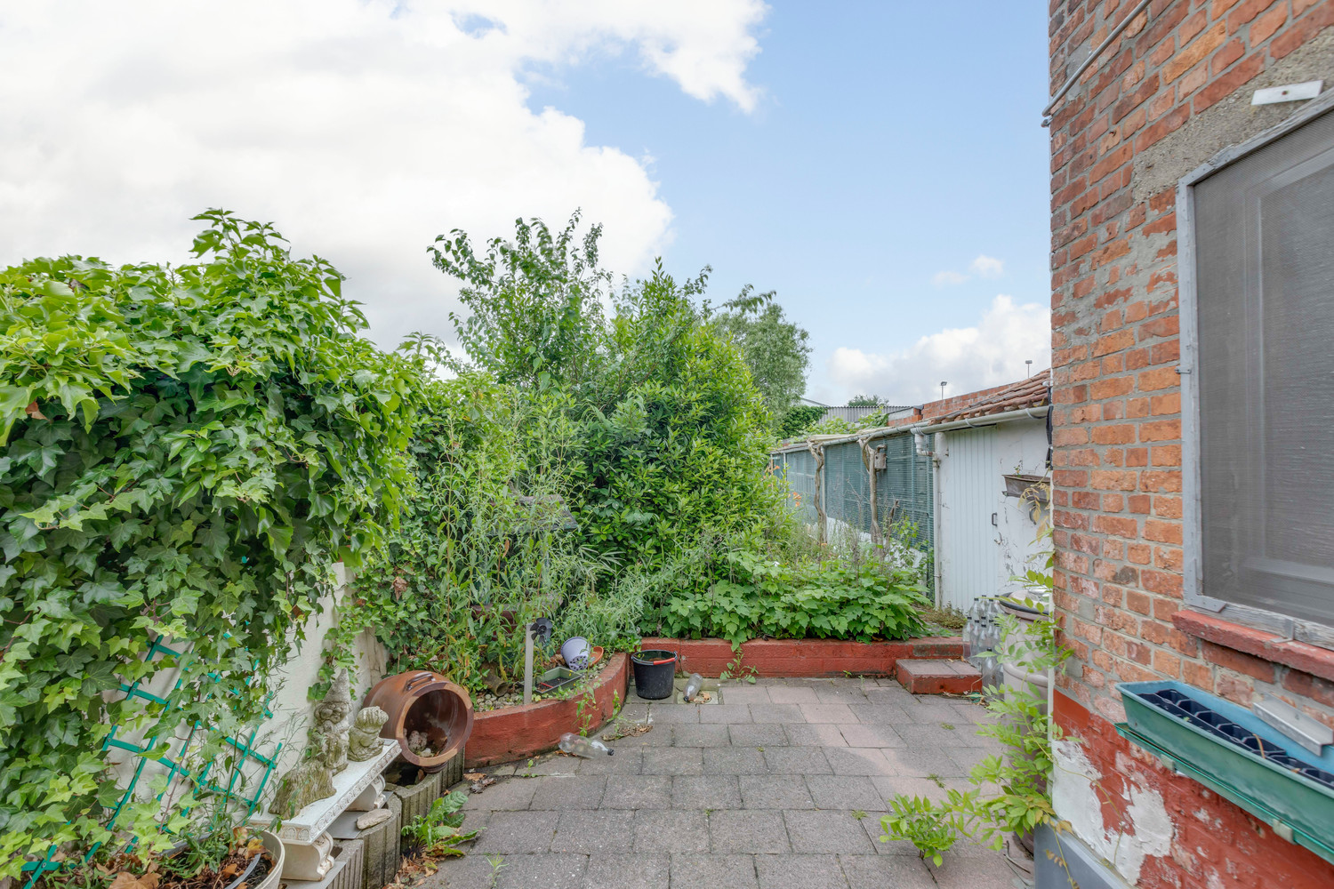 Buitenkans: rijwoning met tuin te Serskamp 