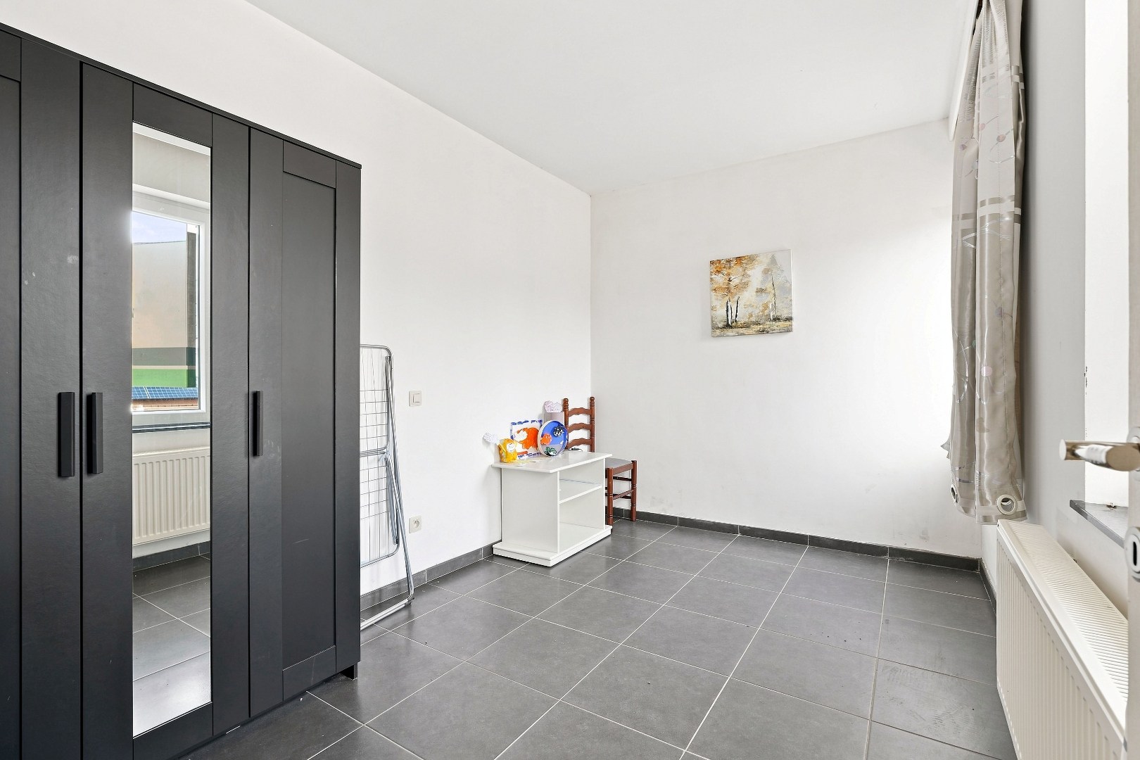 Ruime hoekwoning met 3 woonunits in het centrum van De Panne. 