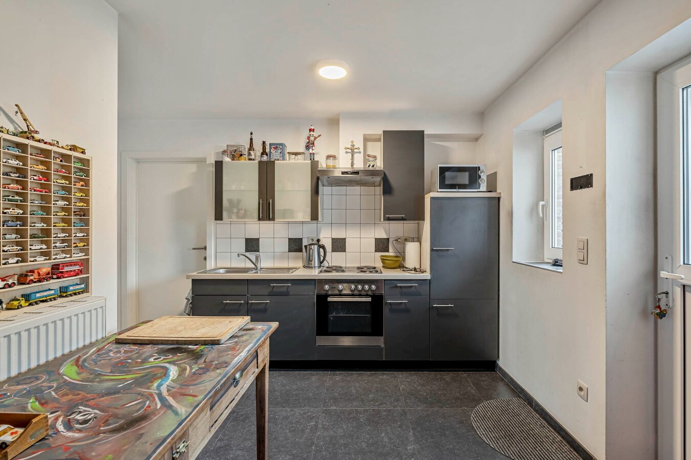 Comfortabel, gelijkvloers appartement mét ruime tuin en carport! 