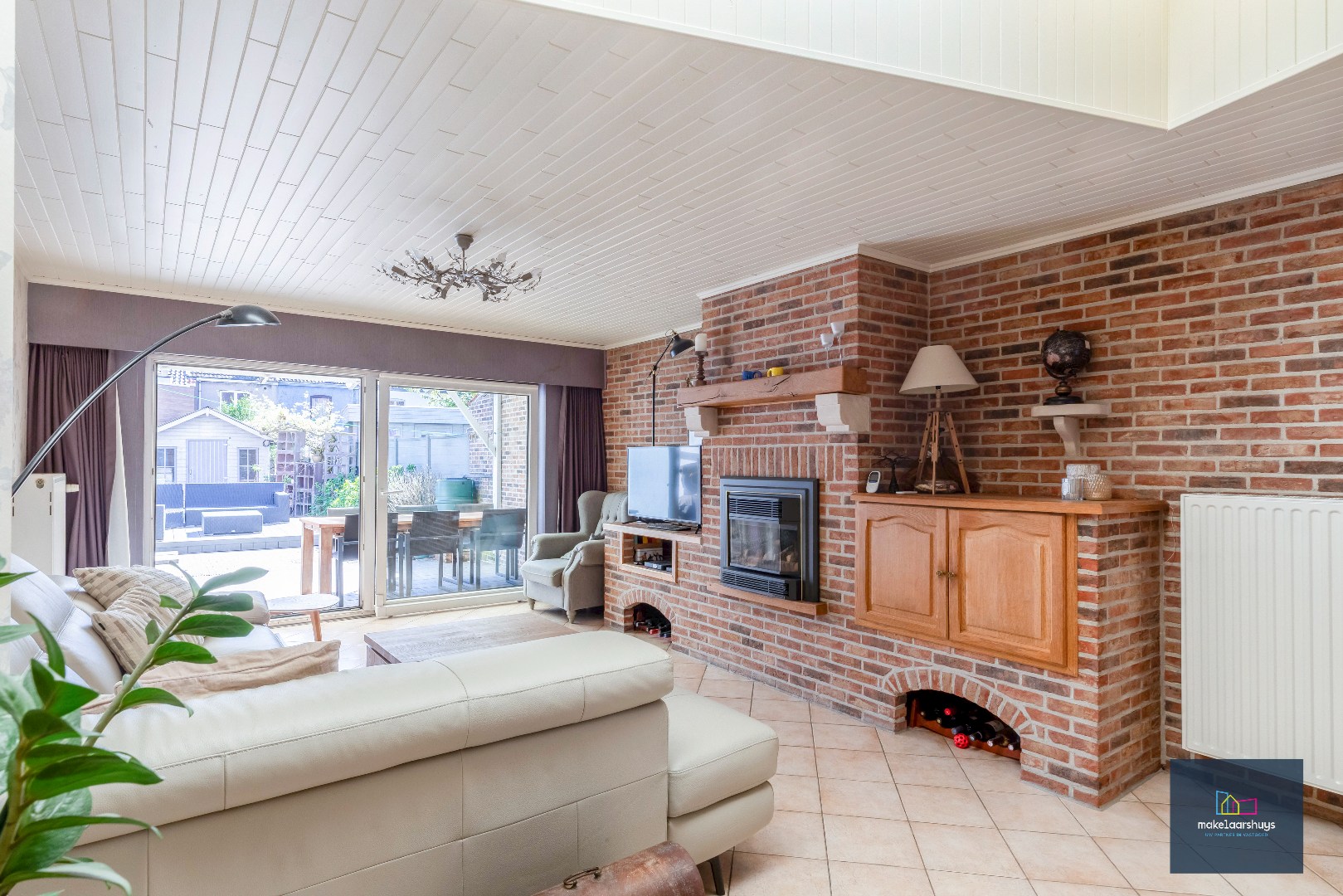 Goed onderhouden en ruime woning in rij met tuin/terras te Wondelgem 
