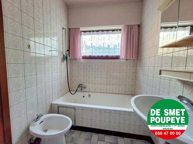 Ruime rijwoning met garage en tuin 