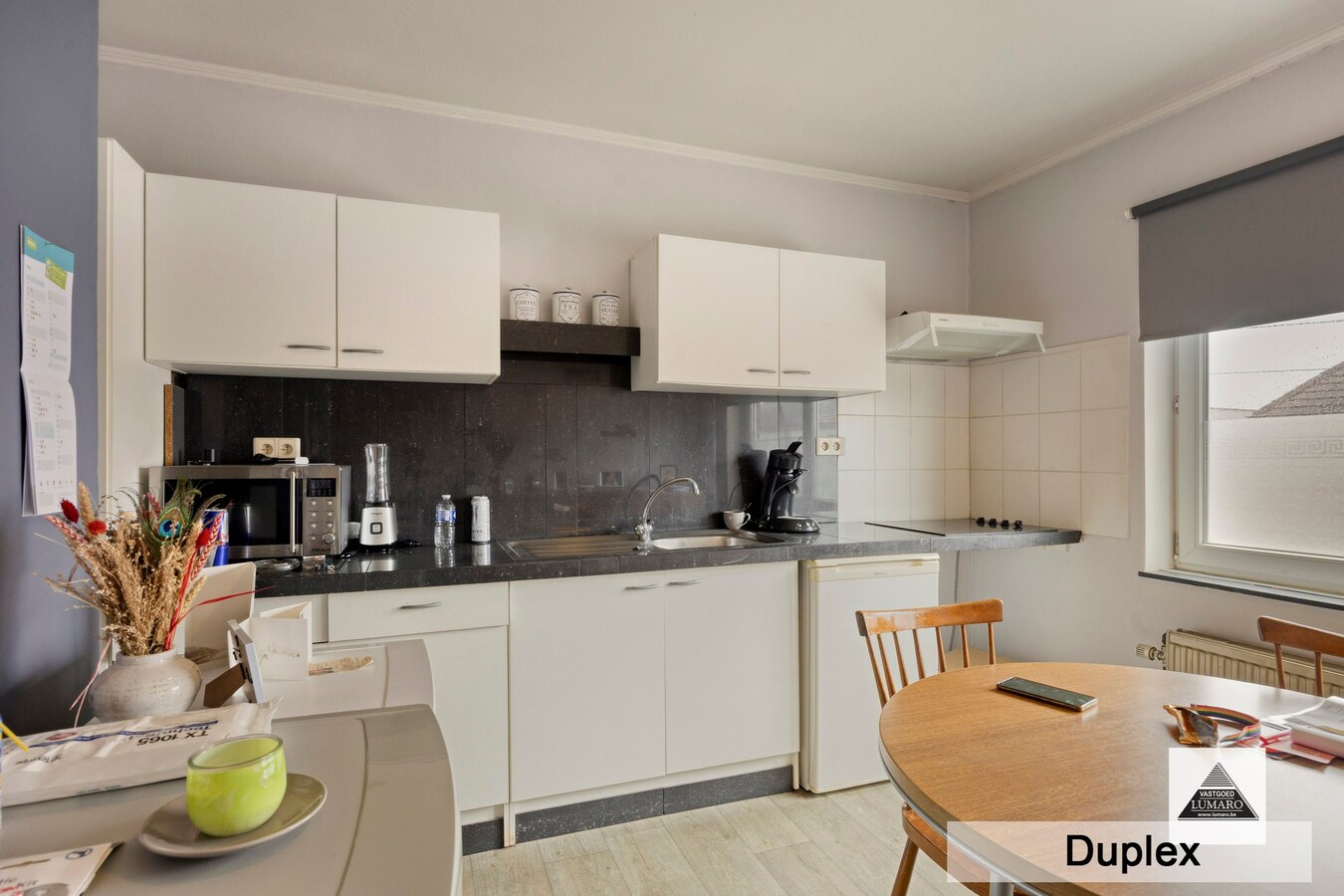 Dilsen-centrum - opbrengstpand: winkel + 2 appartementen 
