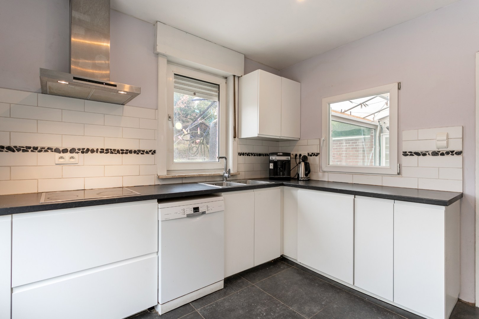 Solide woning met 3 slpks, tuin en garage te Buizingen 