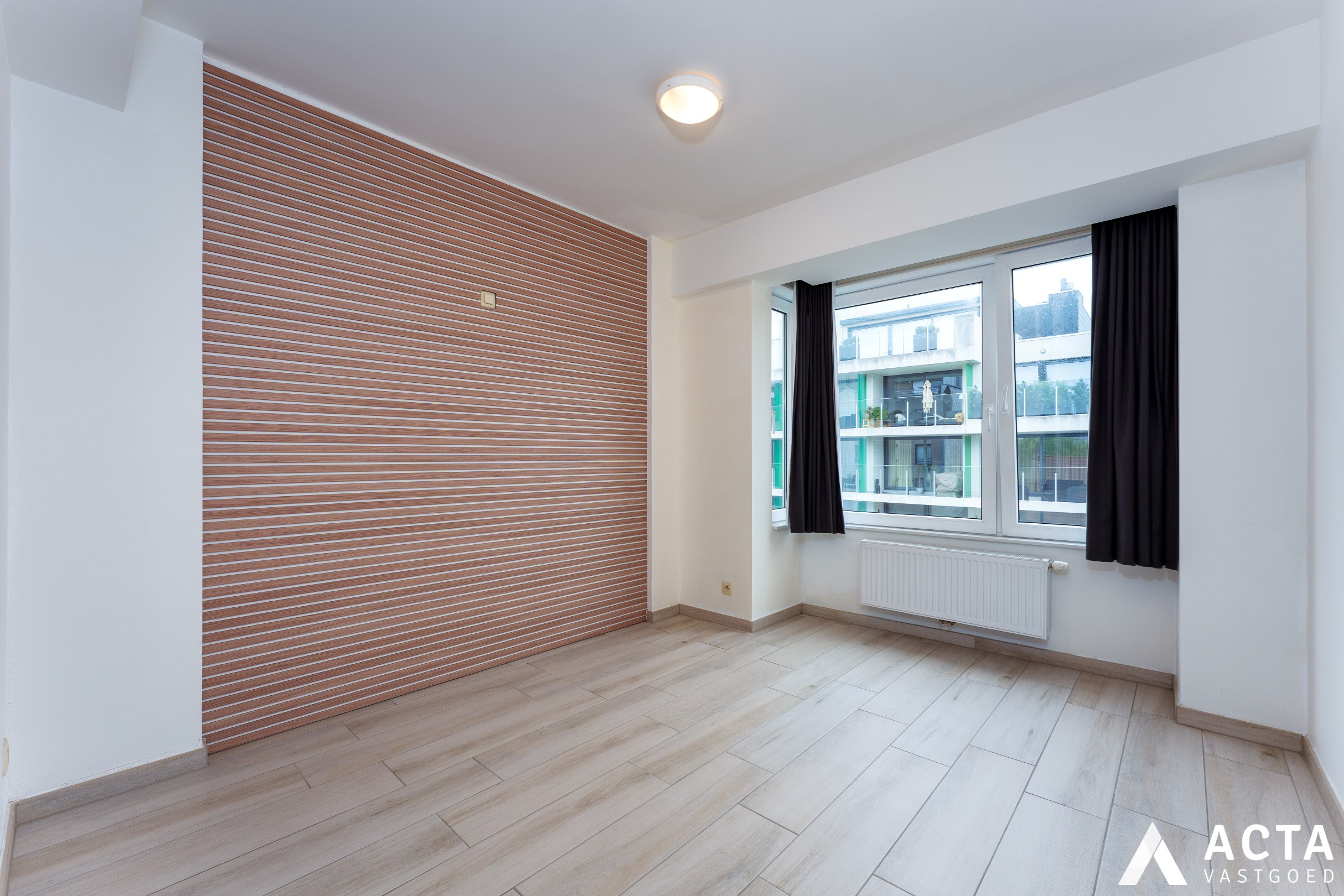 Instapklaar appartement met twee slaapkamers en parkzicht. 